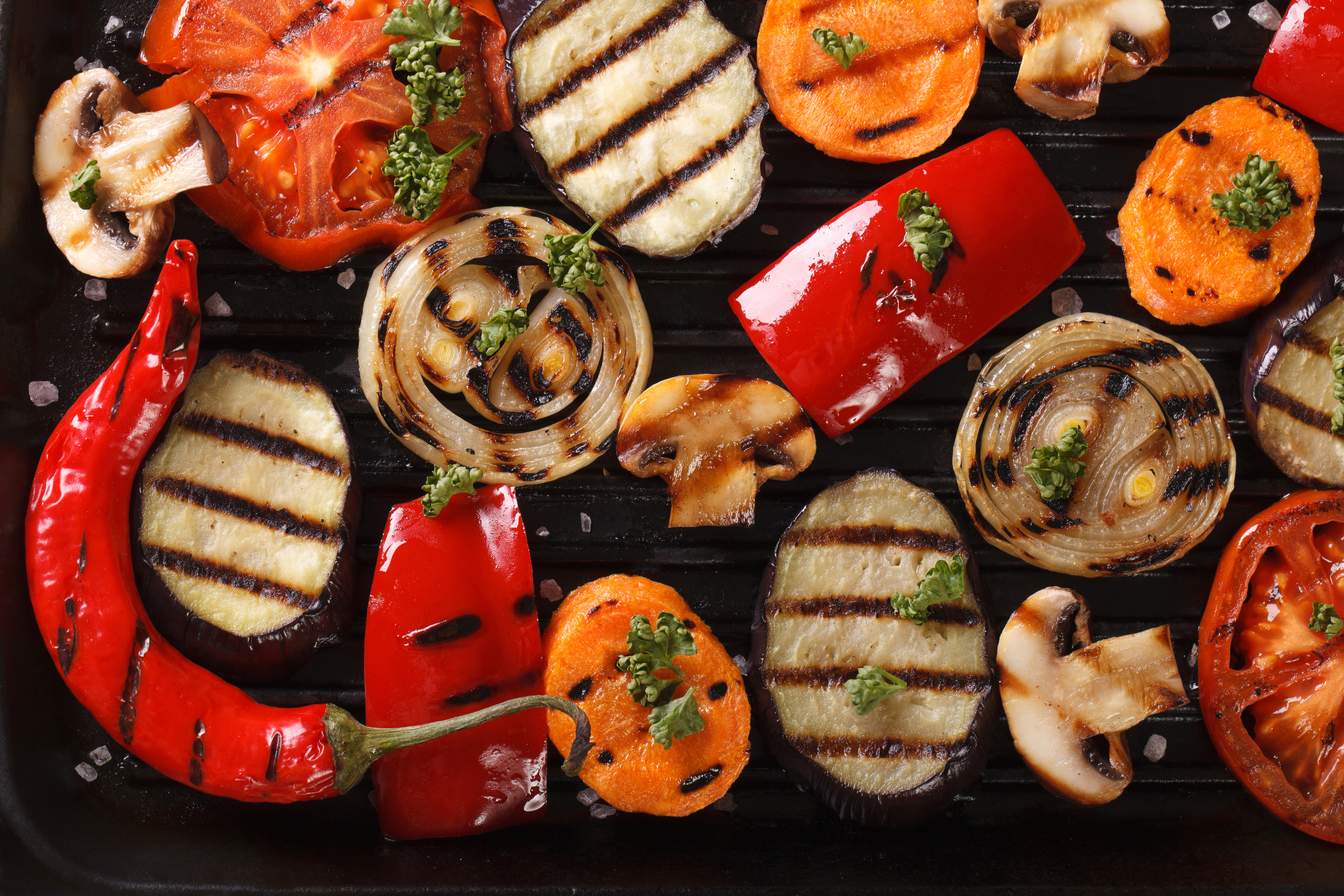 grilling fall vegetables peppers and eggplant on grill