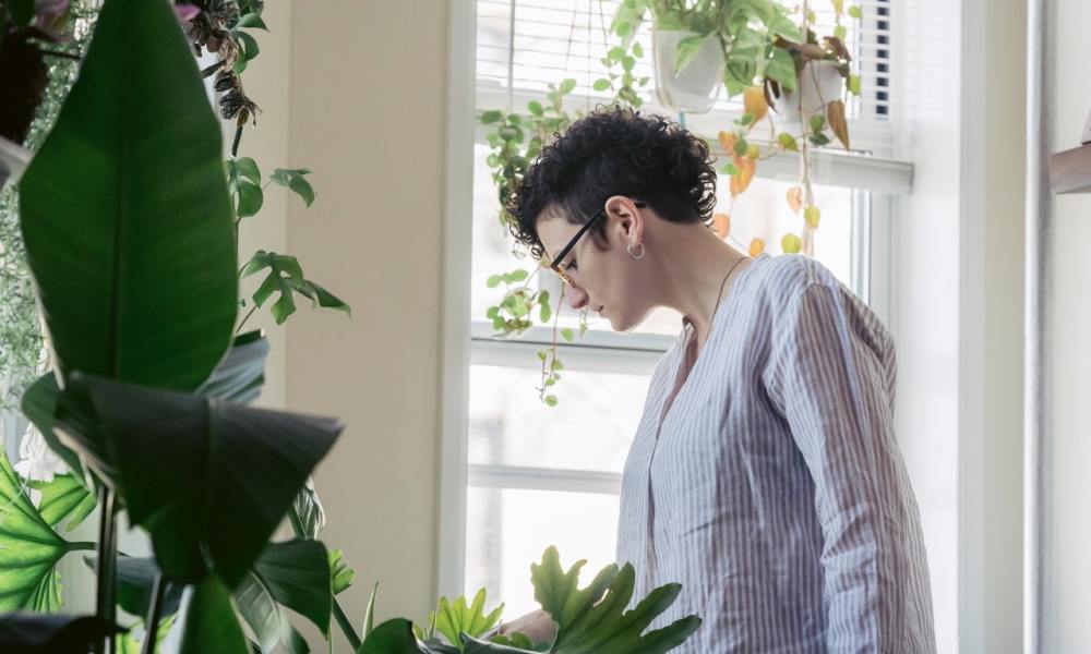 woman caring for plants