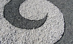 A spiral made of black and white stones