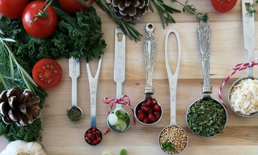 Christmas herbs and spices in measuring spoons